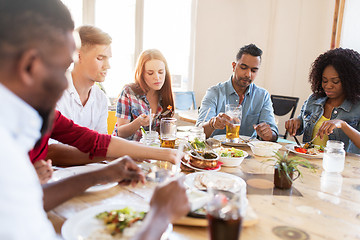 Image showing friends eating at restaurant