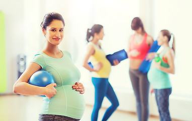 Image showing happy pregnant woman with ball in gym