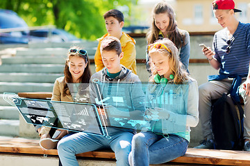 Image showing happy teenage friends with smartphones outdoors