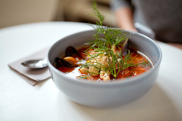 Image showing seafood soup with fish and blue mussels in bowl