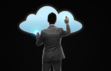 Image showing businessman working with virtual cloud projection
