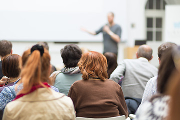 Image showing Man giving presentation in lecture hall at university.