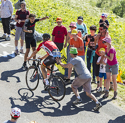 Image showing Spectator Pushing a Cyclist - Tour de France 2016