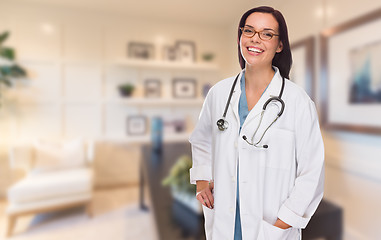 Image showing Young Female Doctor or Nurse Standing in Her Office