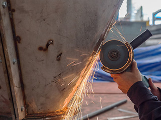 Image showing Angle grinder in use