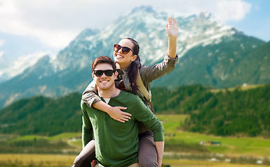 Image showing happy couple with backpacks having fun outdoors