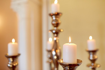 Image showing candles burning in church