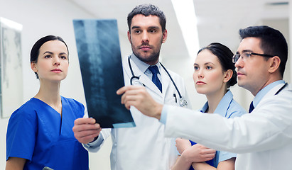 Image showing group of medics with spine x-ray scan at hospital