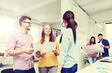 Image showing creative team on coffee break talking at office