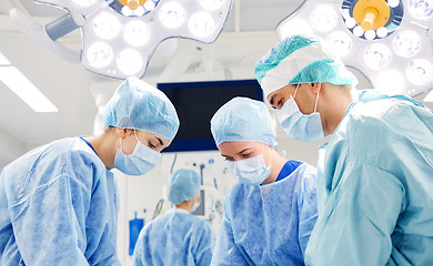 Image showing group of surgeons in operating room at hospital