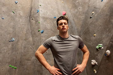 Image showing young man exercising at indoor climbing gym