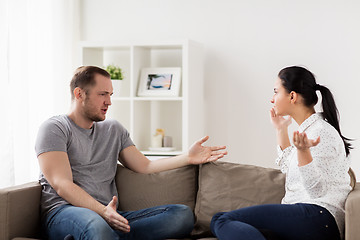 Image showing unhappy couple having argument at home