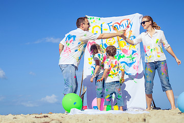 Image showing Happy family playing on the beach at the day time.