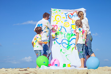 Image showing Happy family playing on the beach at the day time.