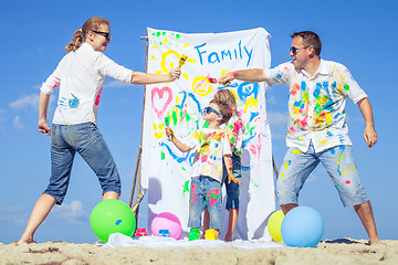 Image showing Happy family playing on the beach at the day time.