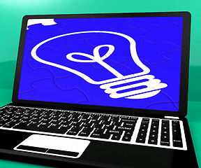 Image showing Bulb Puzzle On Notebook Showing Computer Energy