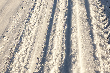 Image showing traces of the car on snow