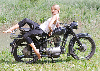 Image showing Young woman on motorcycle