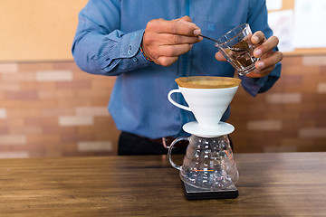 Image showing Barista making a coffee