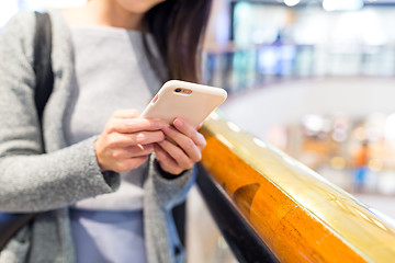 Image showing Woman use of mobile phone at shopping mall