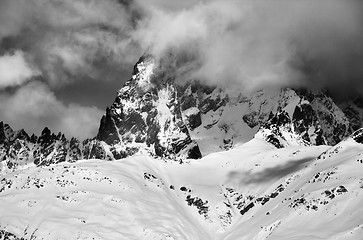 Image showing Black and white view on mount Ushba in fog at sun winter day bef