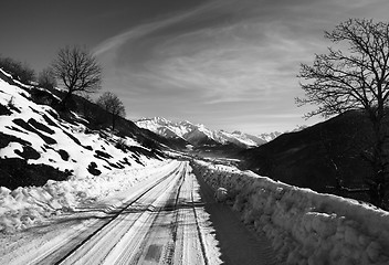 Image showing Black and white view on snow road in winter morning mountain