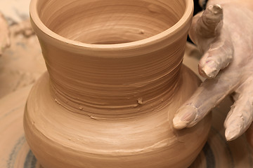 Image showing Process of making crockery on a potter\'s wheel