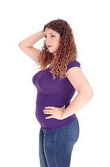 Image showing Curvy woman standing in profile.