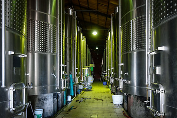 Image showing metal wine barrels in a winery