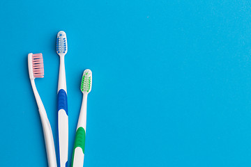 Image showing Colorful toothbrushes, place for inscription