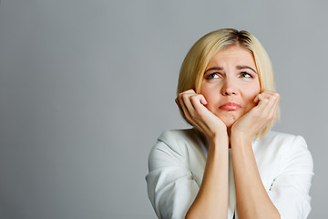 Image showing Woman with hand at chin