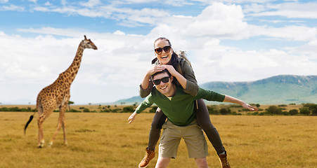 Image showing smiling couple with backpacks traveling in africa