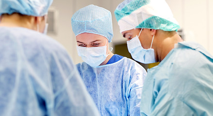 Image showing group of surgeons in operating room at hospital