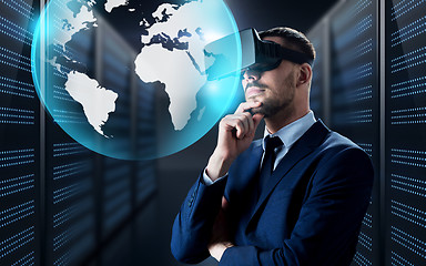 Image showing businessman in virtual reality headset with globe