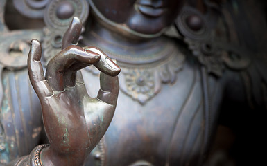 Image showing Detail of Buddha statue with Karana mudra hand position