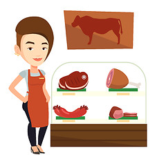 Image showing Butcher offering fresh meat in butchershop.