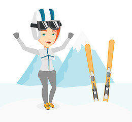 Image showing Cheerful skier standing with raised hands.