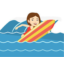 Image showing Happy surfer in action on a surf board.