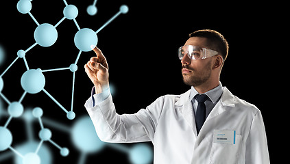 Image showing scientist in goggles with molecule projection