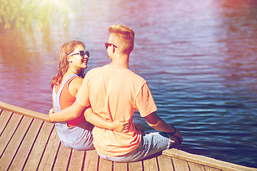 Image showing happy teenage couple hugging on river berth