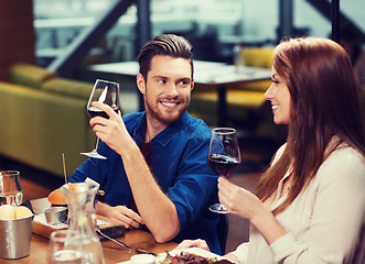 Image showing couple dining and drinking wine at restaurant