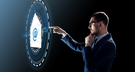 Image showing businessman with e-mail message hologram