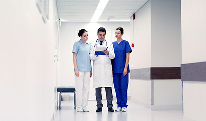 Image showing group of medics at hospital with clipboard