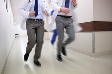 Image showing close up of medics or doctors running at hospital