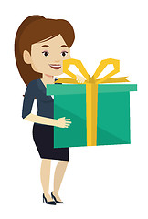 Image showing Joyful caucasian woman holding box with gift.