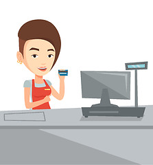 Image showing Cashier holding credit card at the checkout.