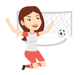 Image showing Soccer player celebrating scoring goal.