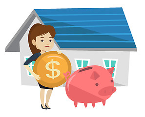 Image showing Woman puts money into piggy bank for buying house.