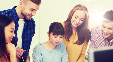 Image showing happy creative team or students working at office