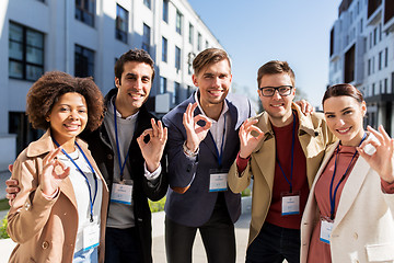 Image showing business team with conference badges in city